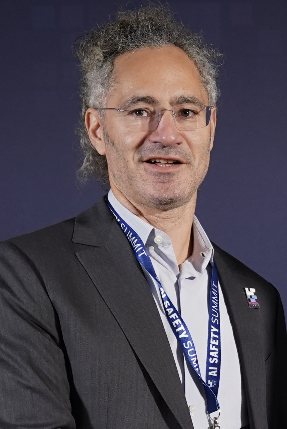 Alex Karp, Palantir CEO, speaking at AIPcon 9 about Claude remaining in military use